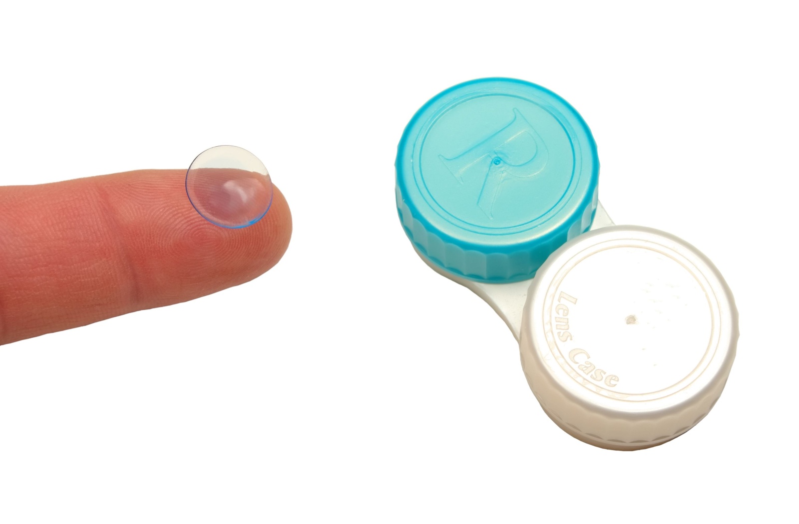 Contact lens on index finger and a lens storage case, over white background.